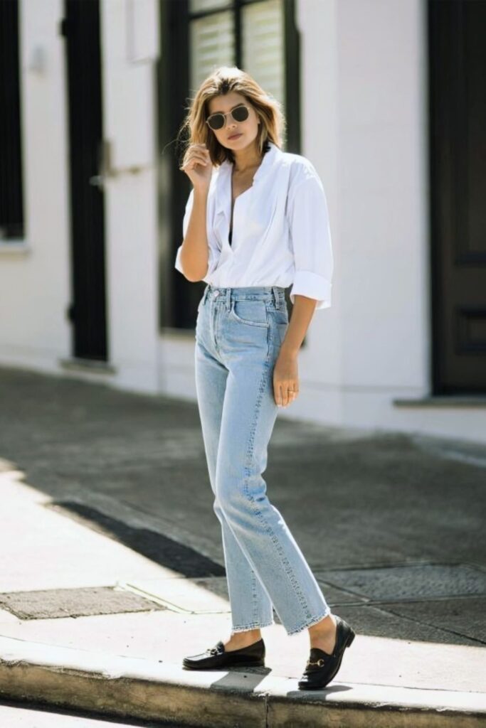 Oversized white button down with light jeans and chunky black loafers