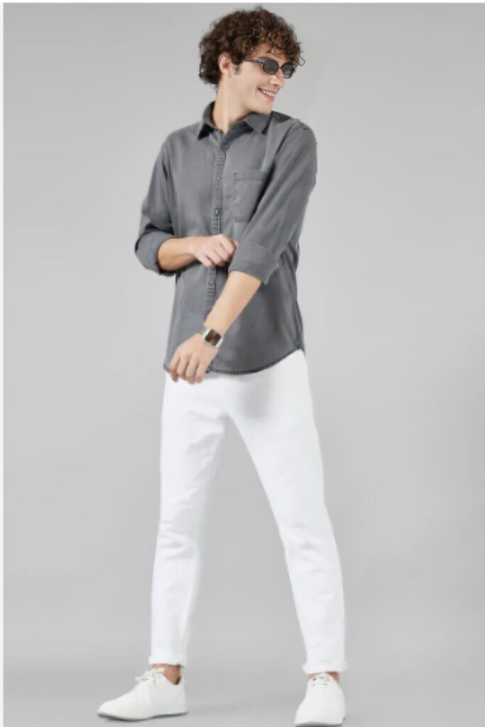 model in grey shirt and white pants