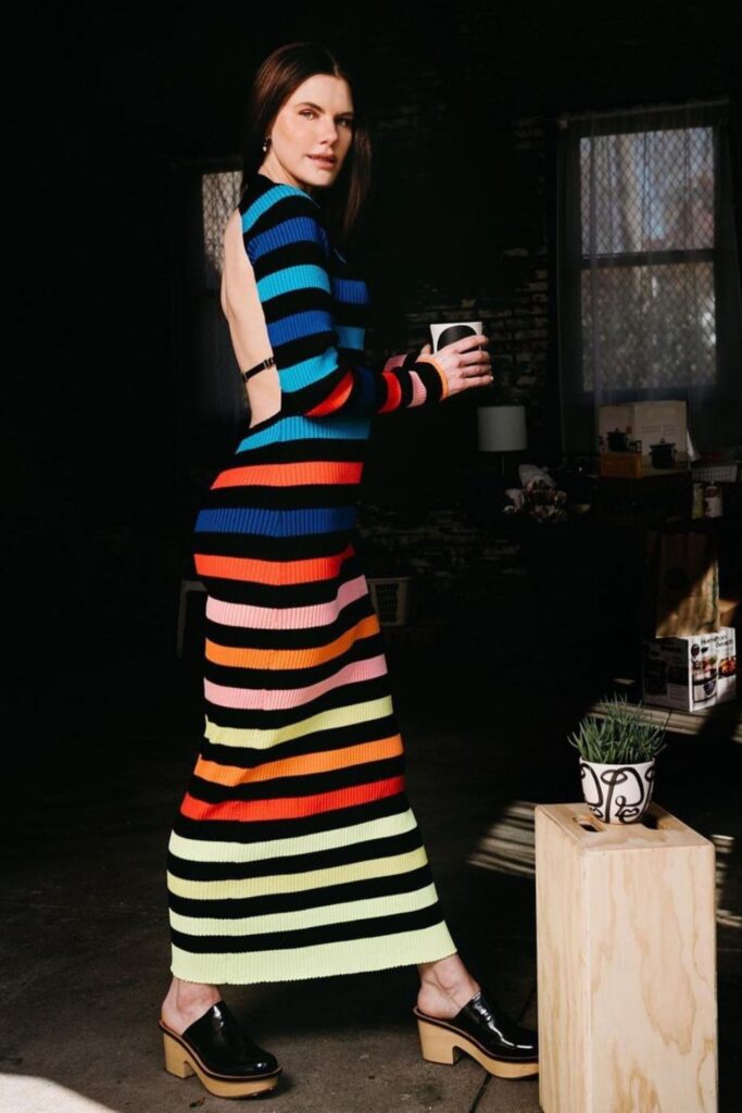 woman wearing colorful striped outfit