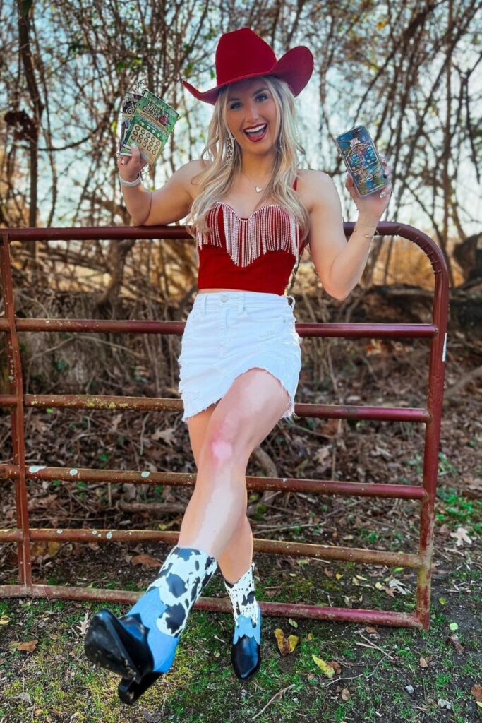 Sleeveless Fringe Top, Mini Skirt, and Cow Print Boots