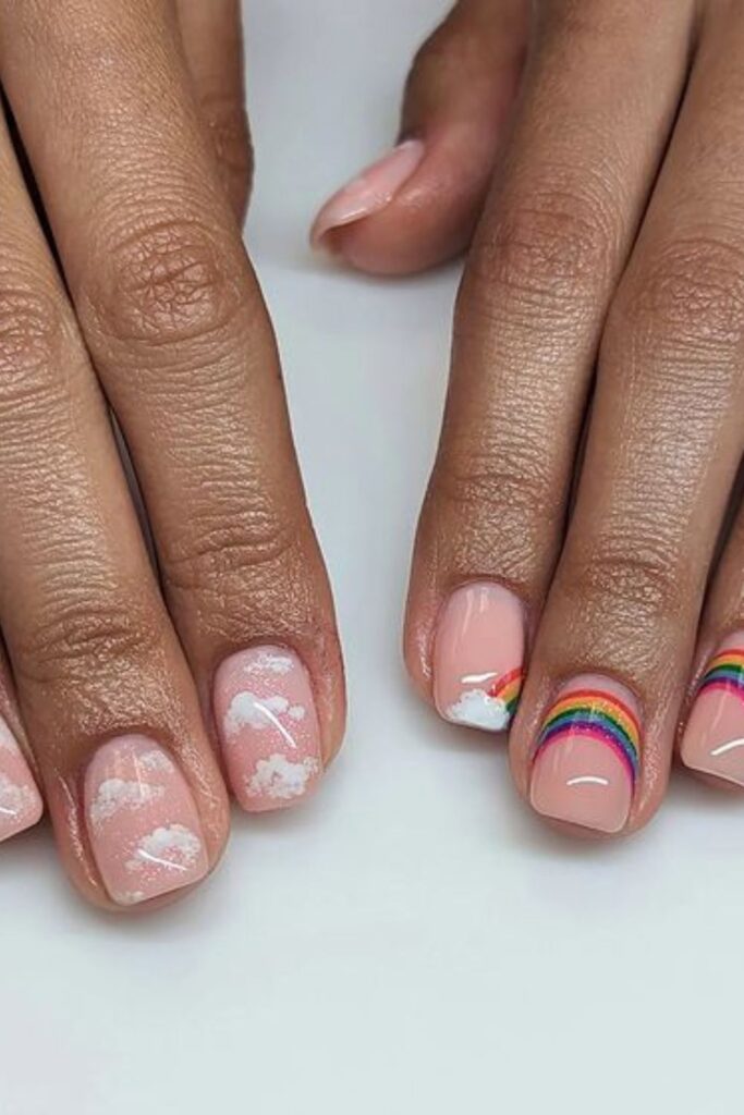 Light Pink Nails with White Clouds and Rainbows