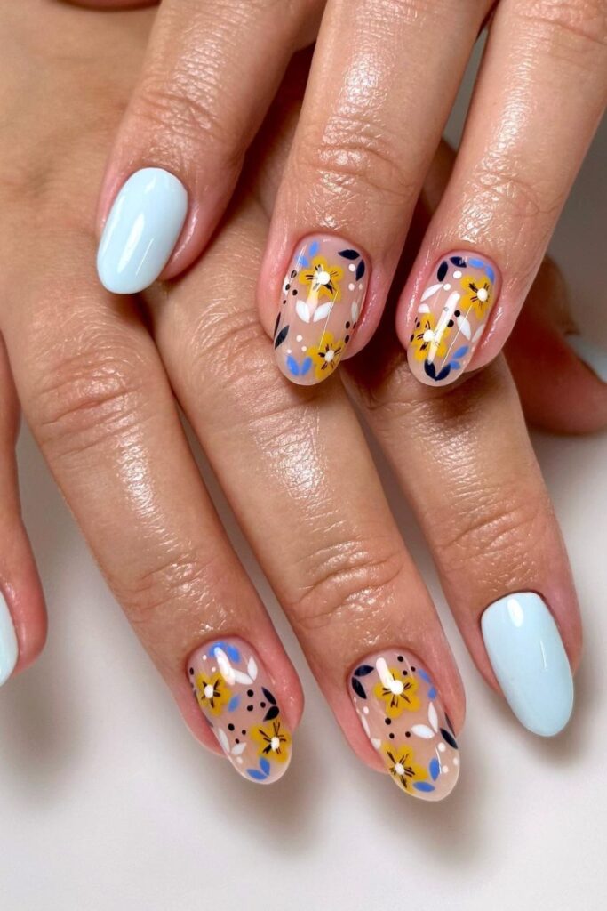 Light Blue Nails with Colorful Abstract Designs