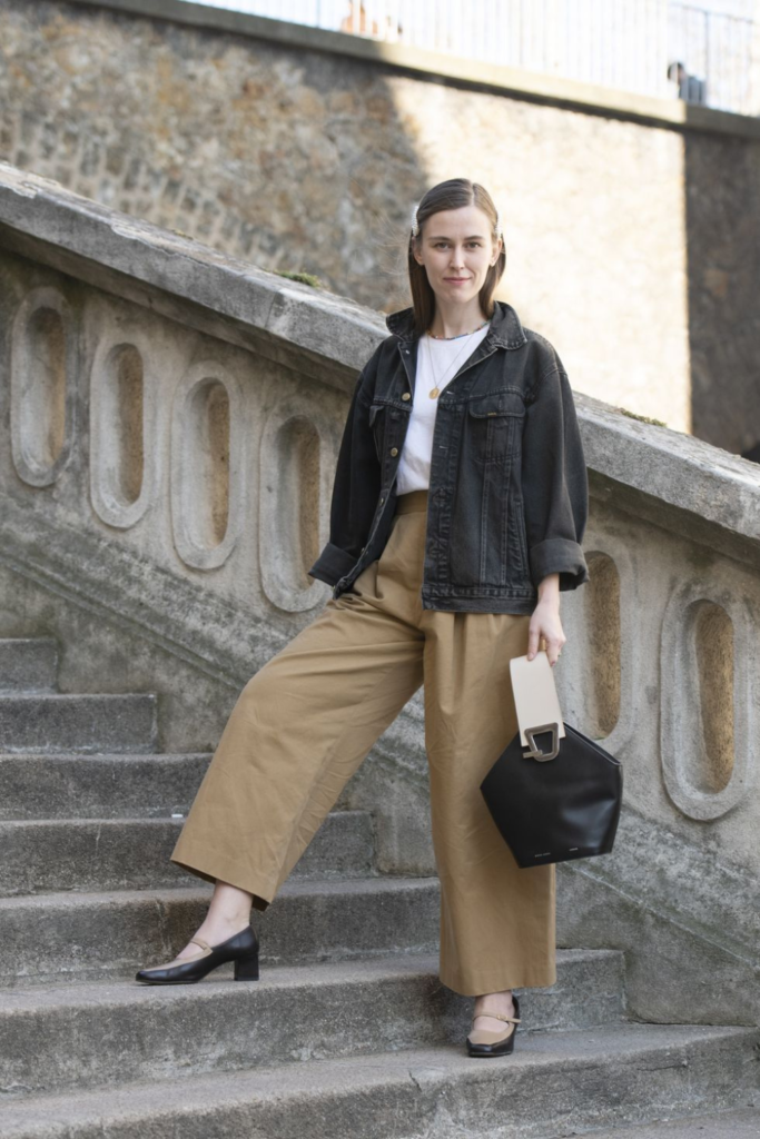 woman wearing brown jeans with an oversized denim jacket