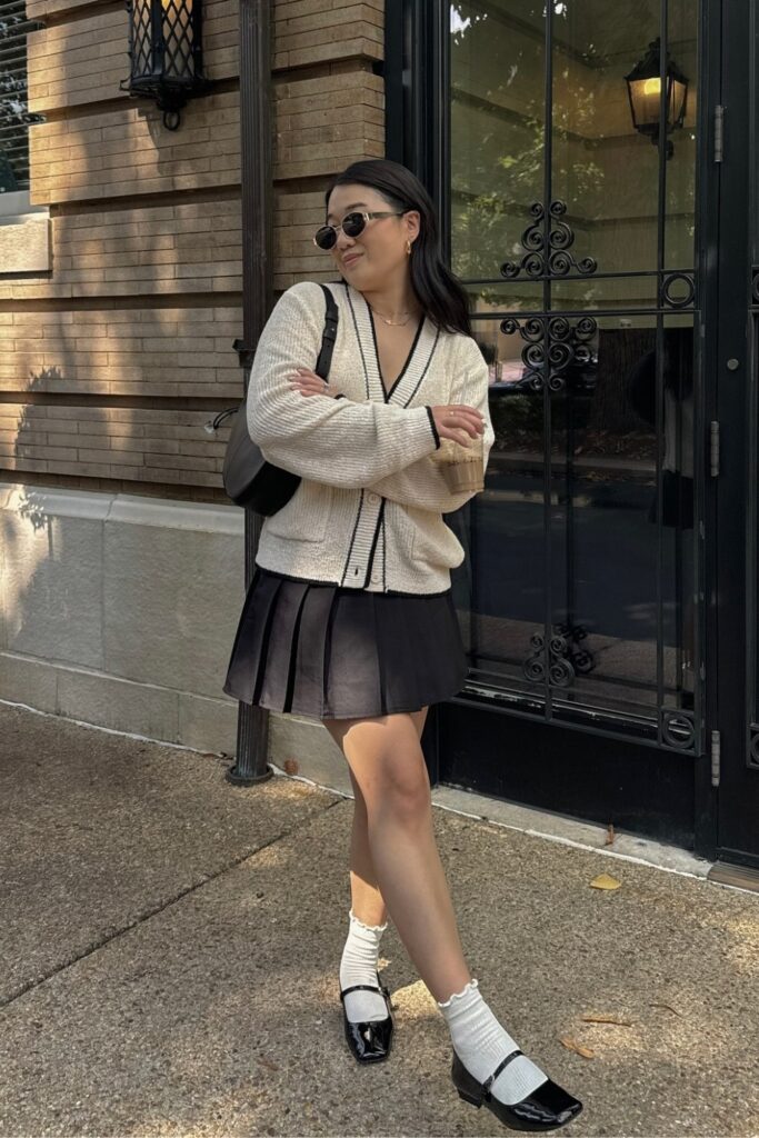 Black and White Cardigan With a Pleated Skirt