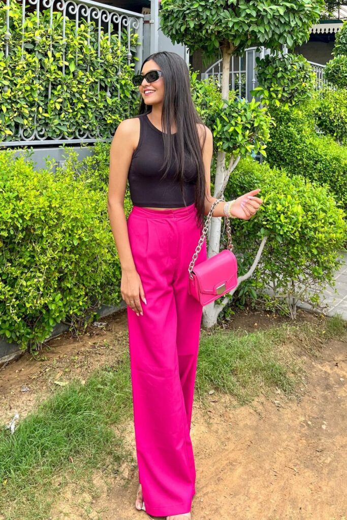 Sleeveless Black Top and Wide-Leg Hot Pink Pants