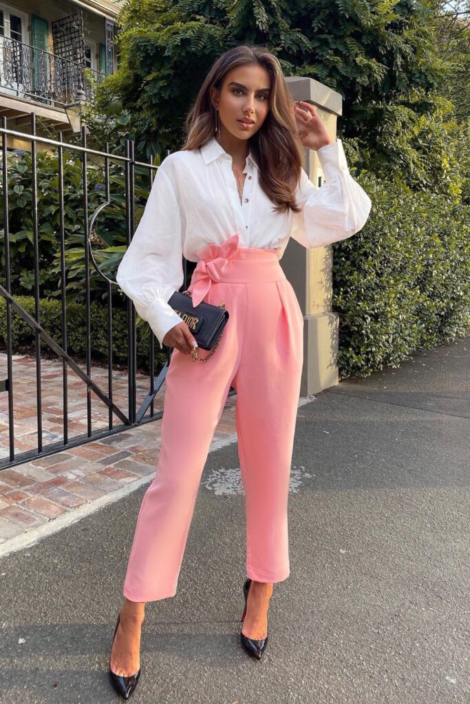 White Button-Up Shirt, High-Waisted Pink Trousers, and Black Heels