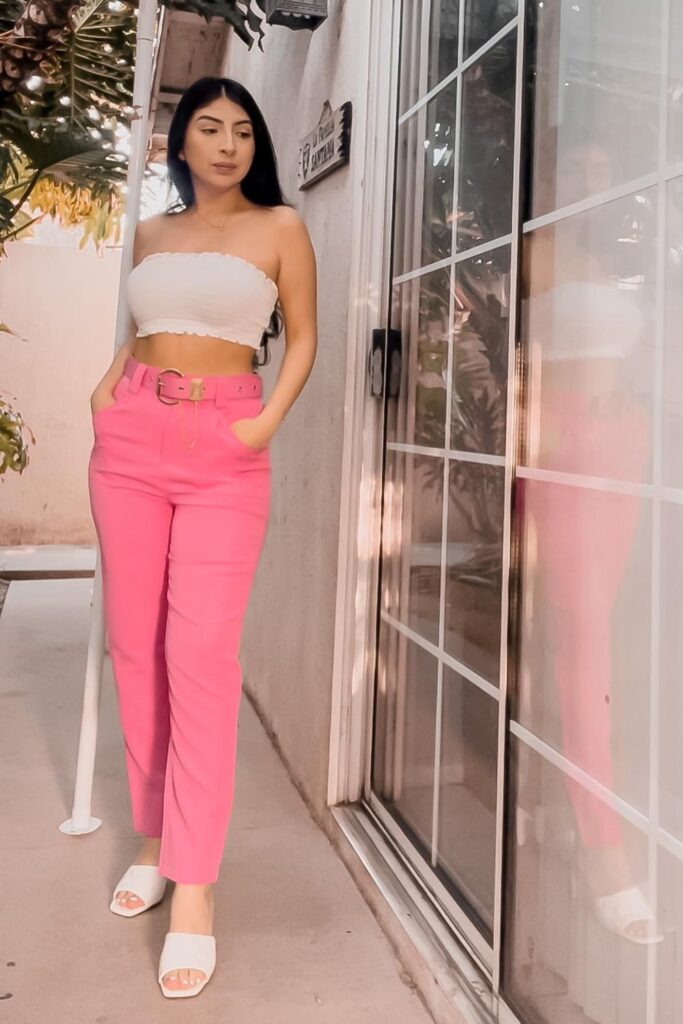 White Strapless Crop Top, High-Waisted Pink Pants, and White Slide Sandals