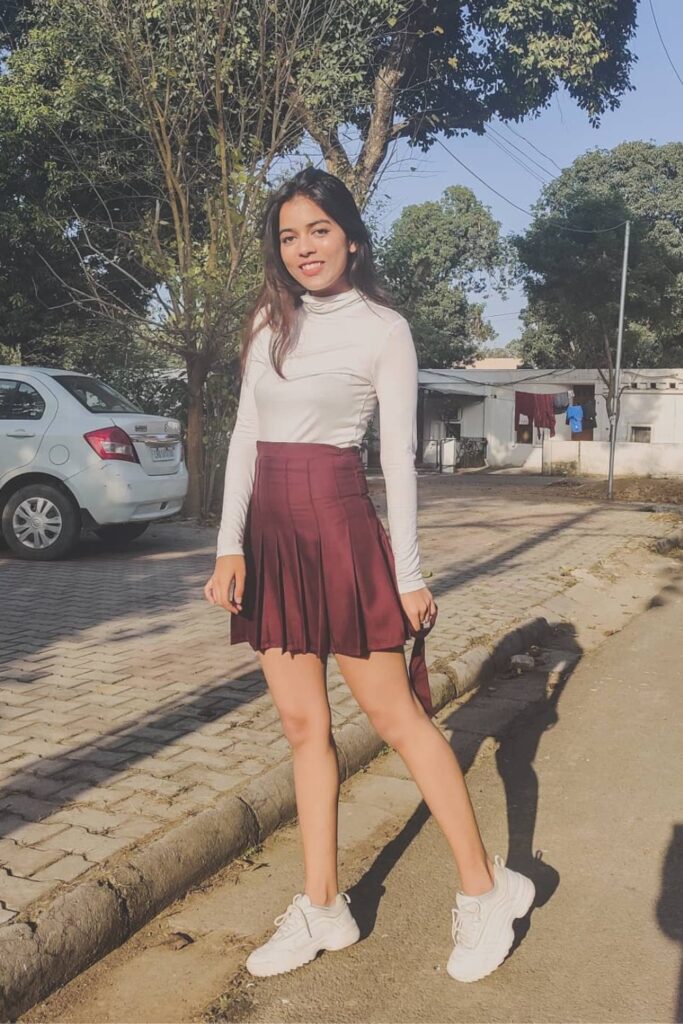 Turtleneck, Burgundy Skirt and White Sneakers