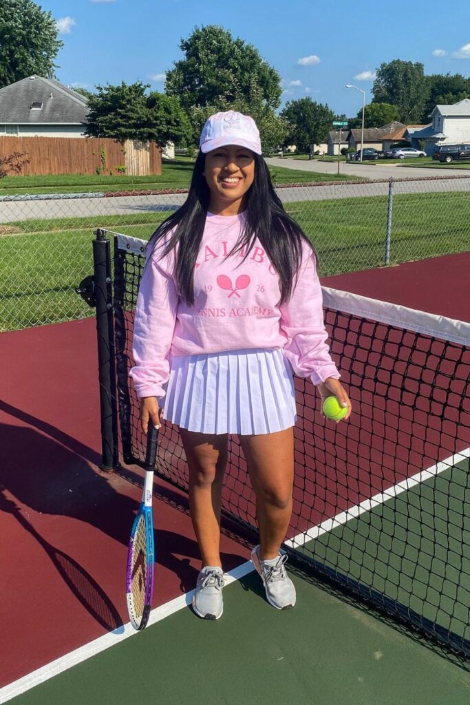 Graphic Sweatshirt, White Skirt, Sneakers and Cap