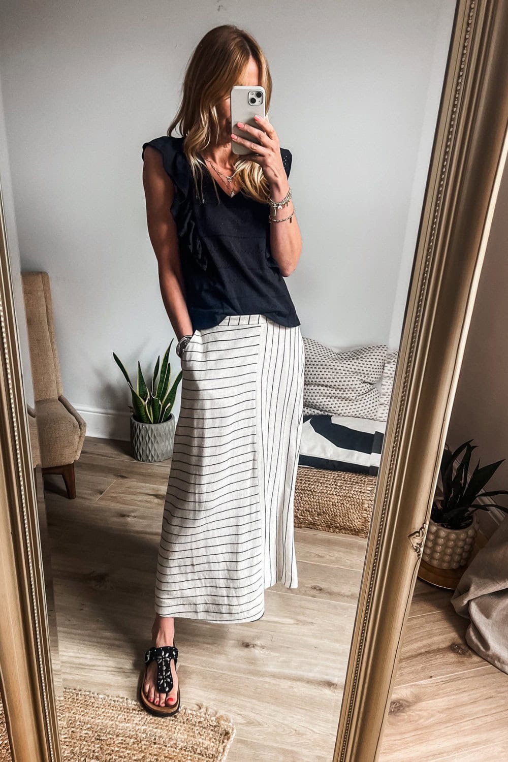 Black V-Neck Top and Striped Skirt
