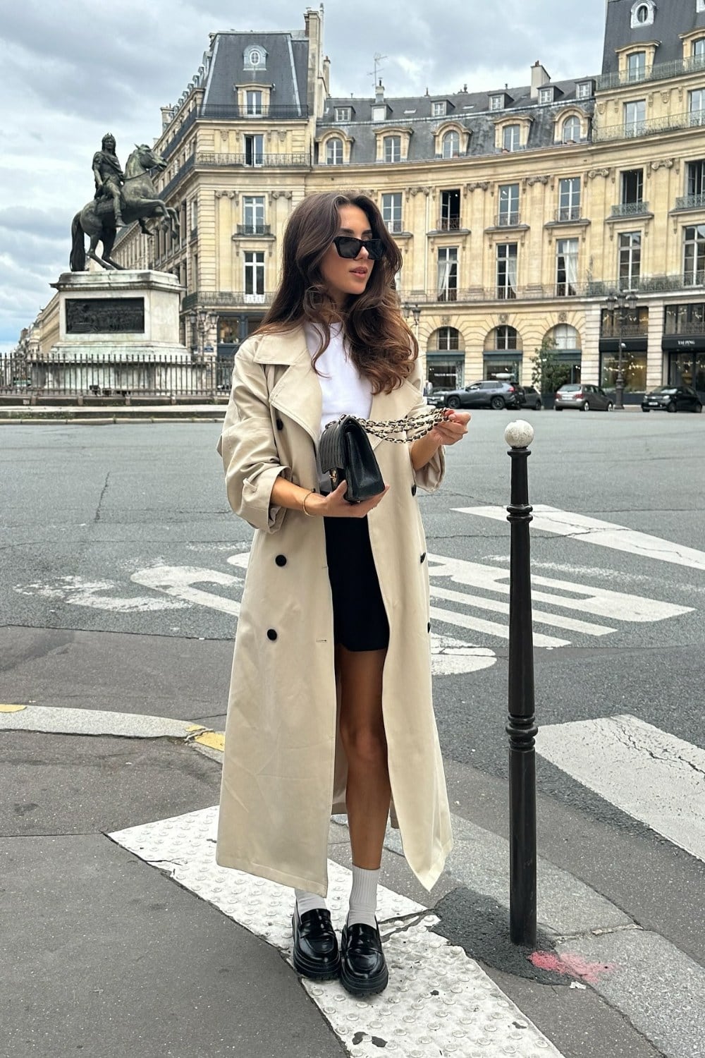 Beige Trench Coat, White Top, and Black Shorts