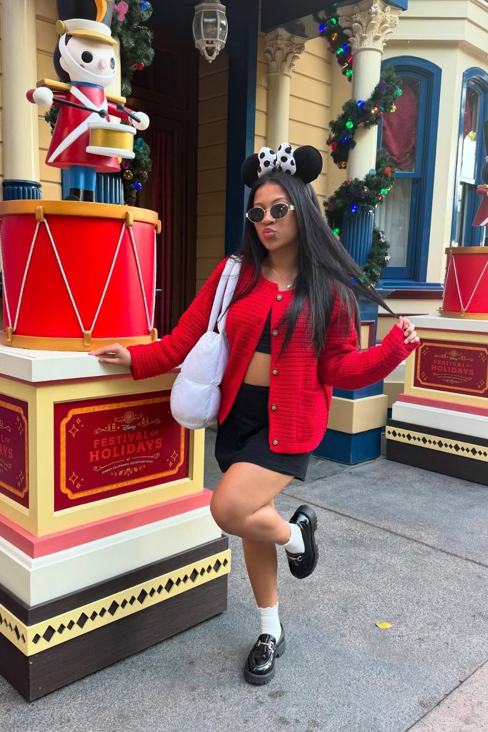 Red Knit Cardigan and Black Shorts