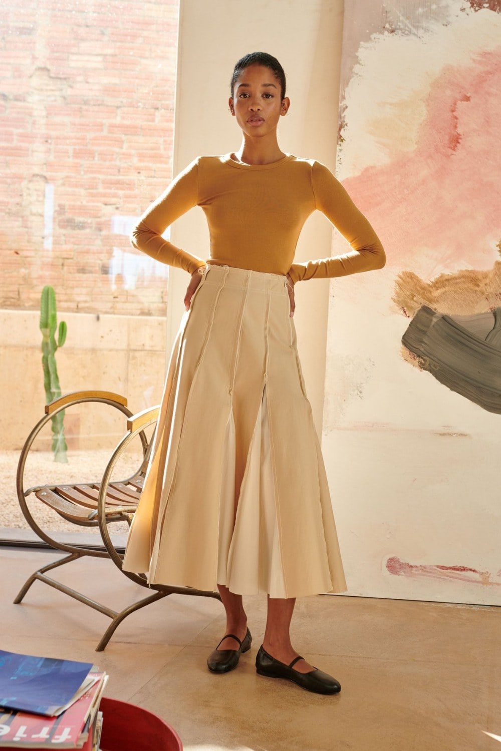 Mustard Bodysuit and Pleated Skirt