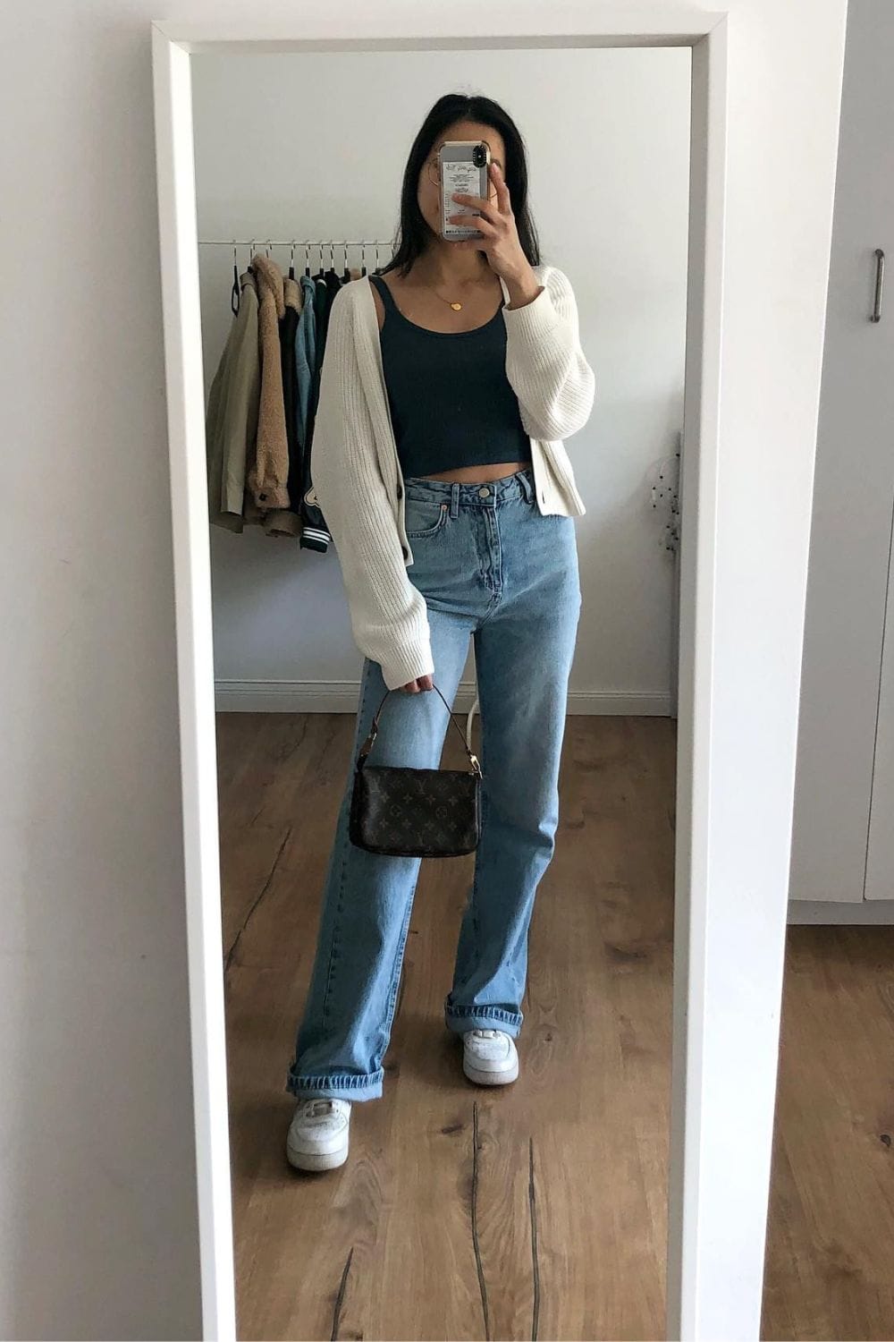 Black Crop Top, Light Wash Jeans, and White Cardigan