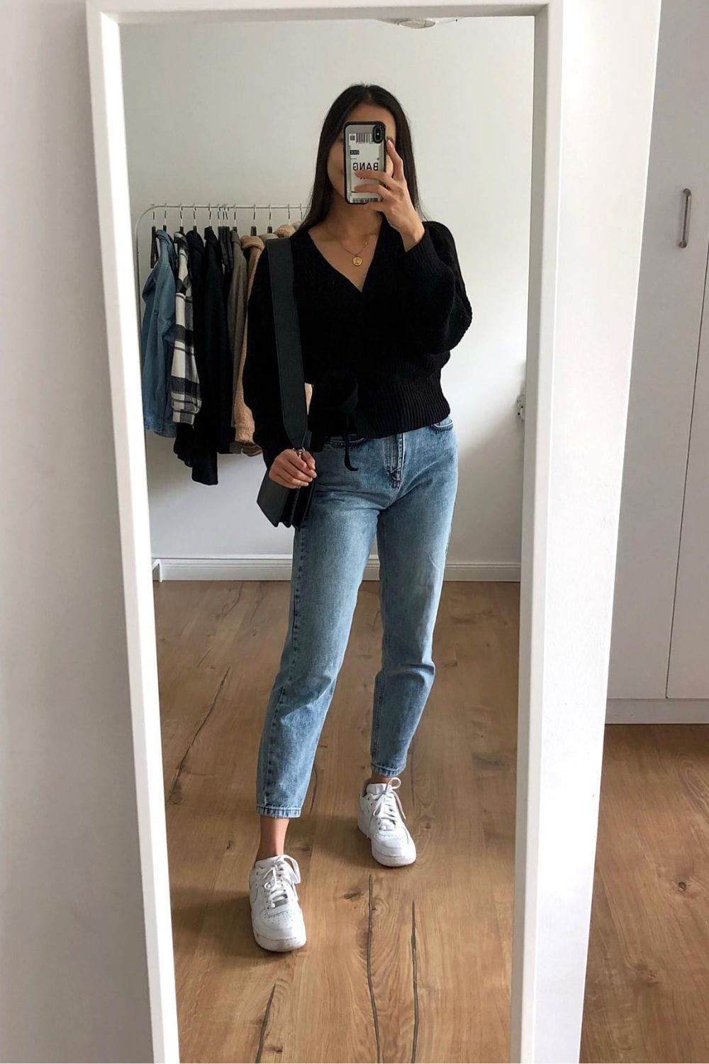 Black Wrap Top and Light Wash Jeans