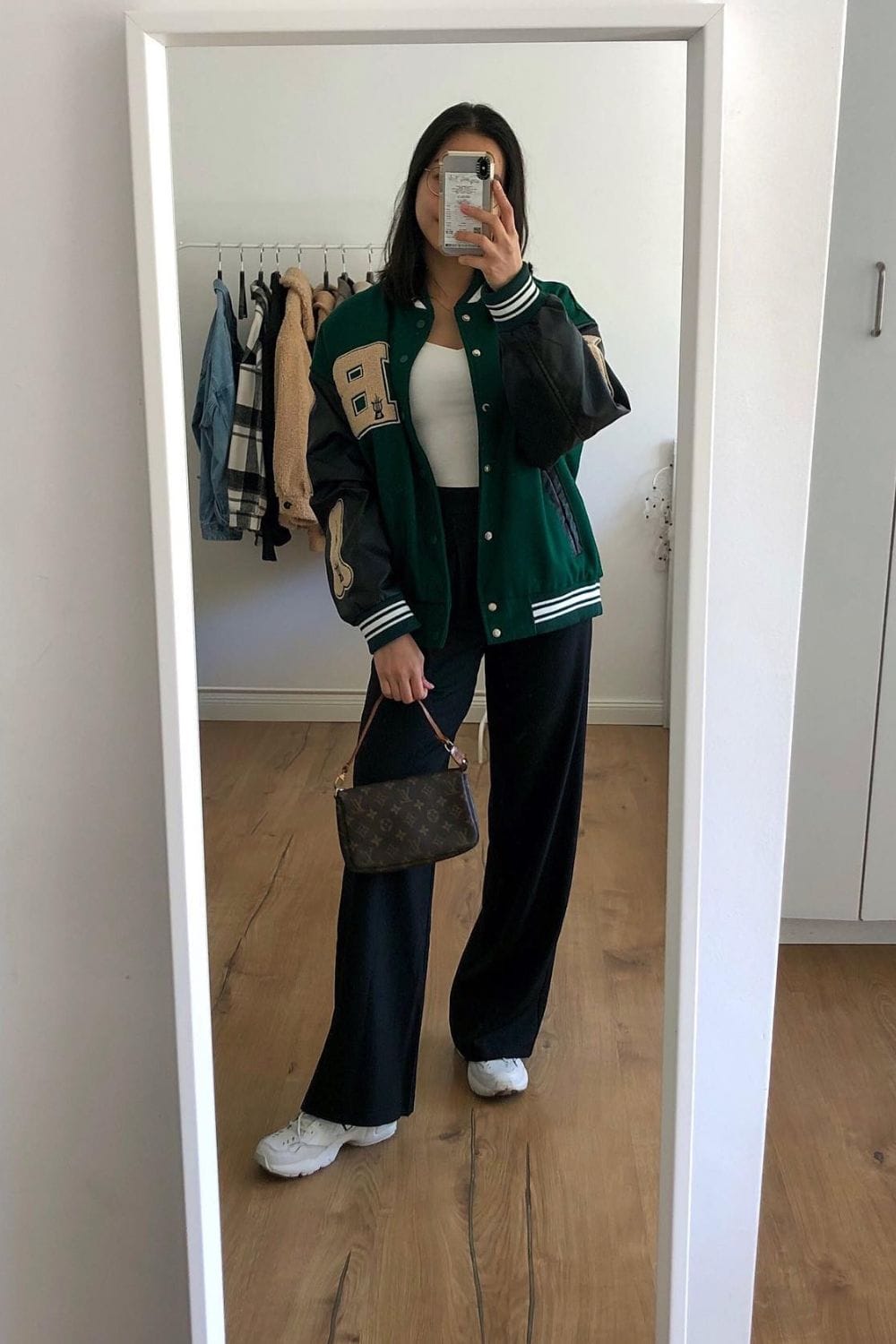 Varsity Jacket, White Tank Top, and Black Wide-Leg Pants