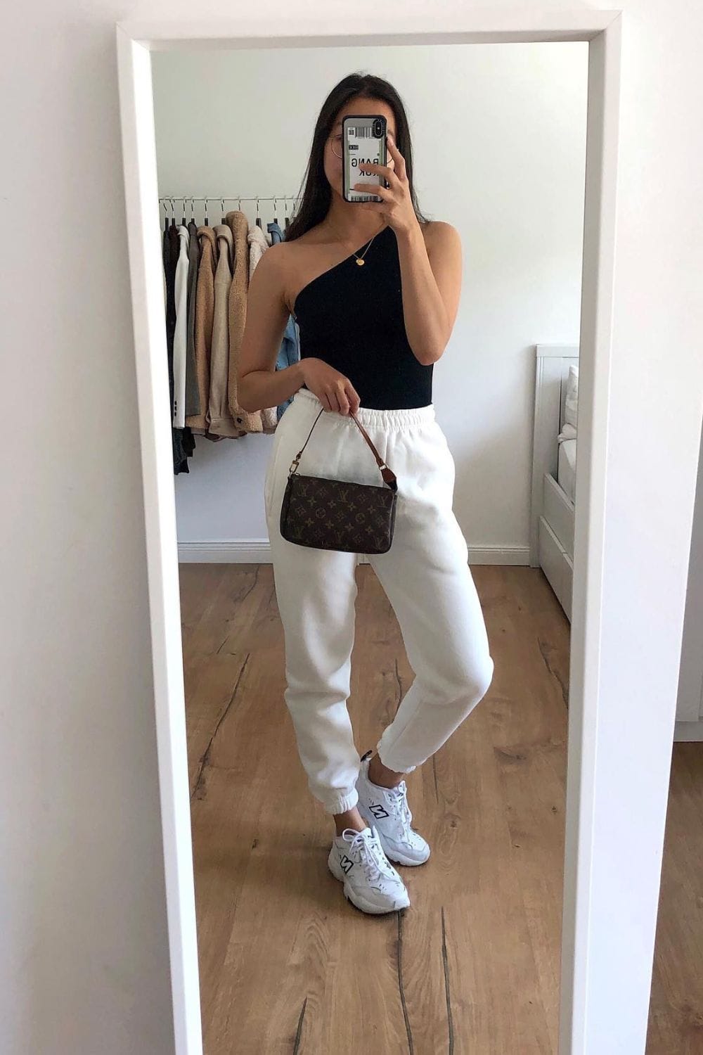 Black One-Shoulder Top and White Sweatpants
