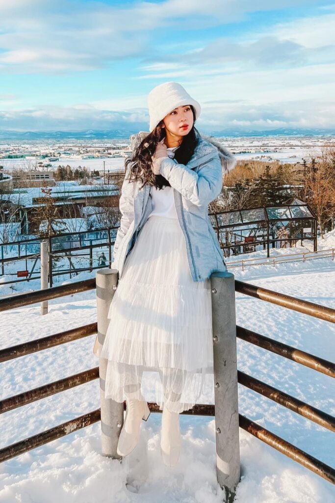 White Tiered Skirt and Light Blue Puffer