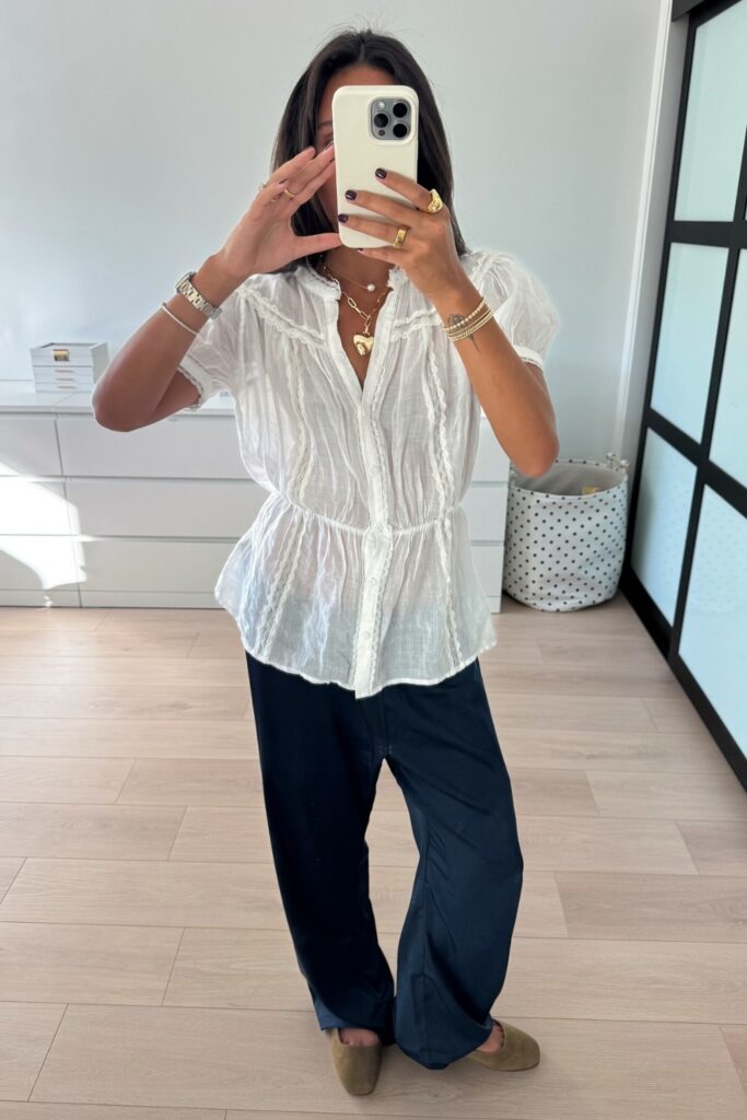 White Semi-Sheer Blouse and Navy Pants
