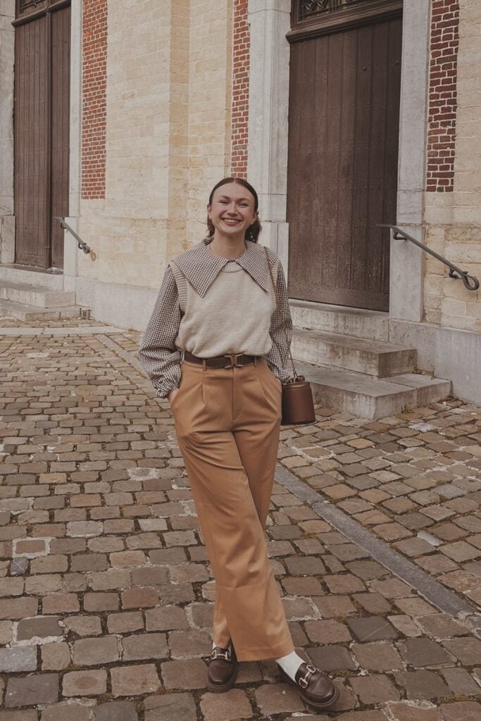 Cream Sweater Vest and Wide-Leg Trousers