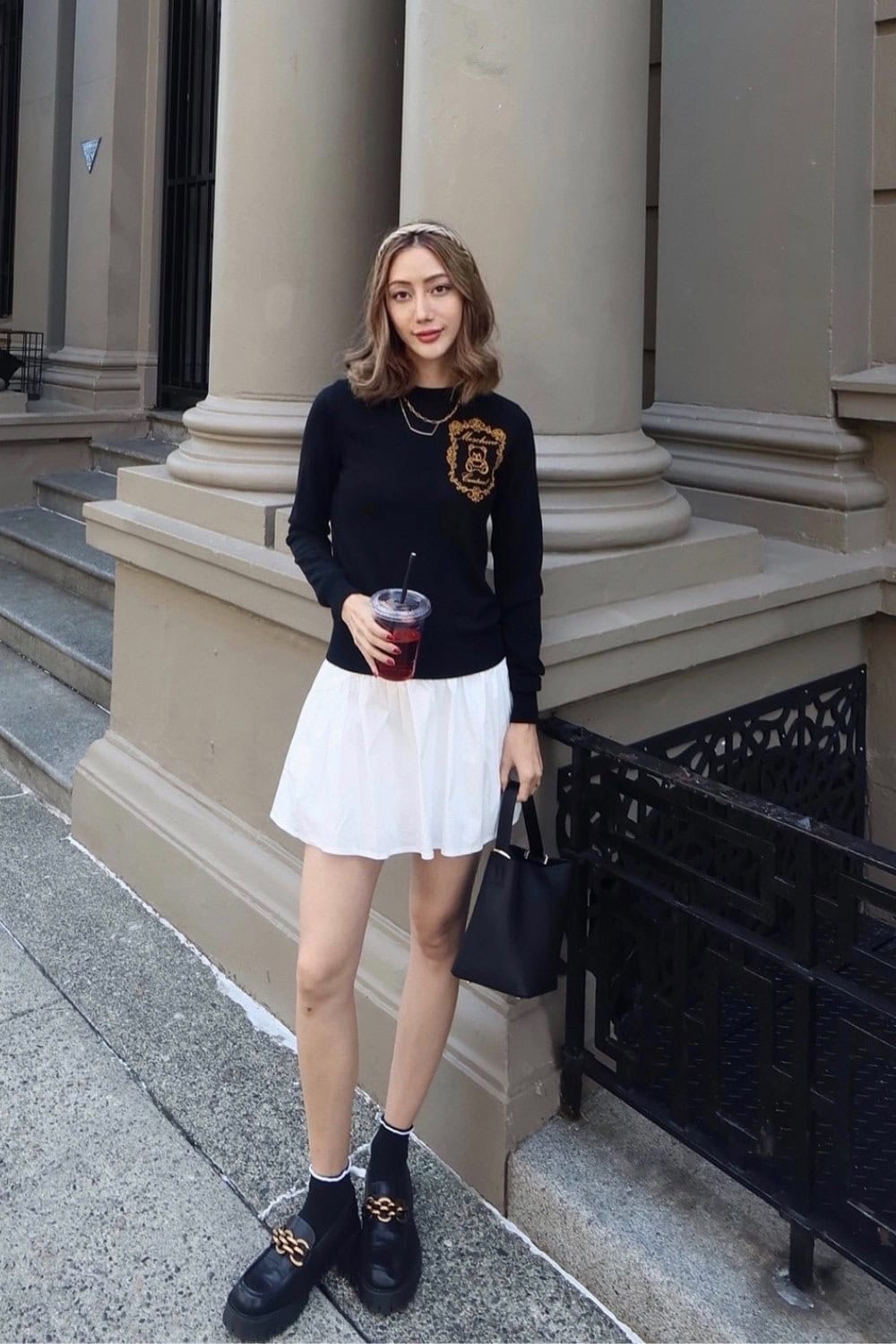 Black Crewneck Sweater and White Pleated Skirt