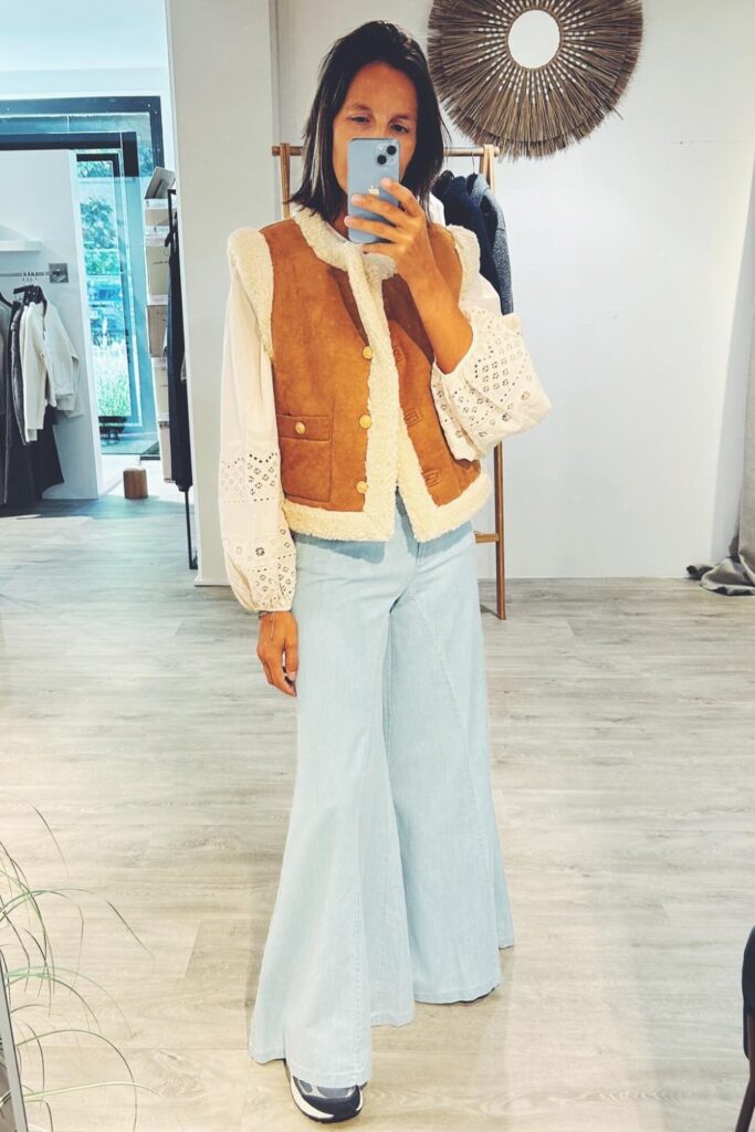 Tan Sherpa Vest and White Eyelet Blouse