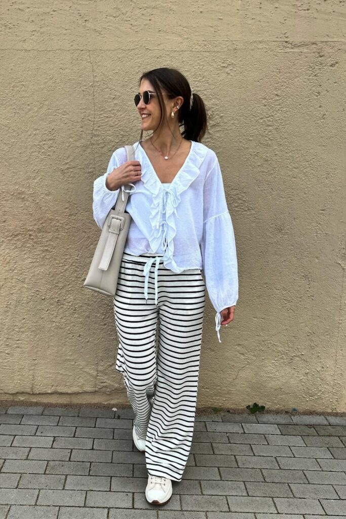 Ruffle-Front Blouse and Sneakers