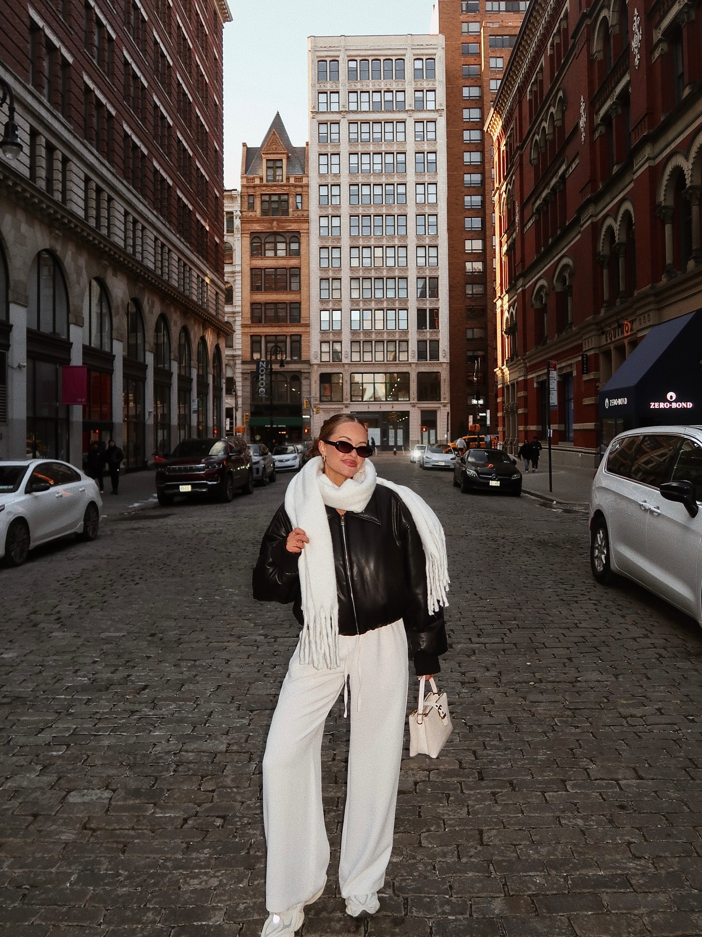 Black Leather Jacket and Cream Pants