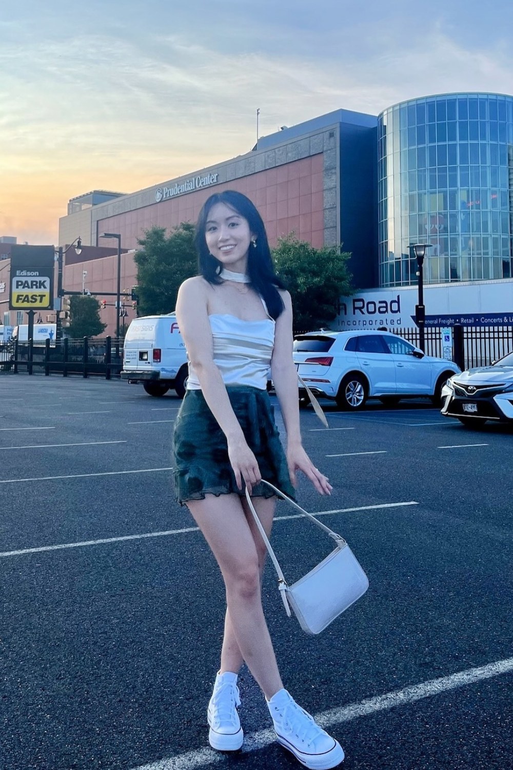 White Camisole and Dark Mini Skirt