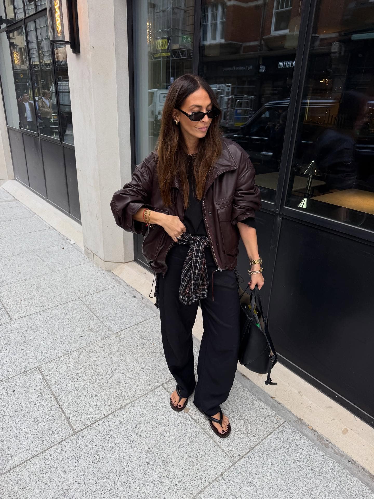 Brown Leather Jacket and Black Wide-Leg Trousers