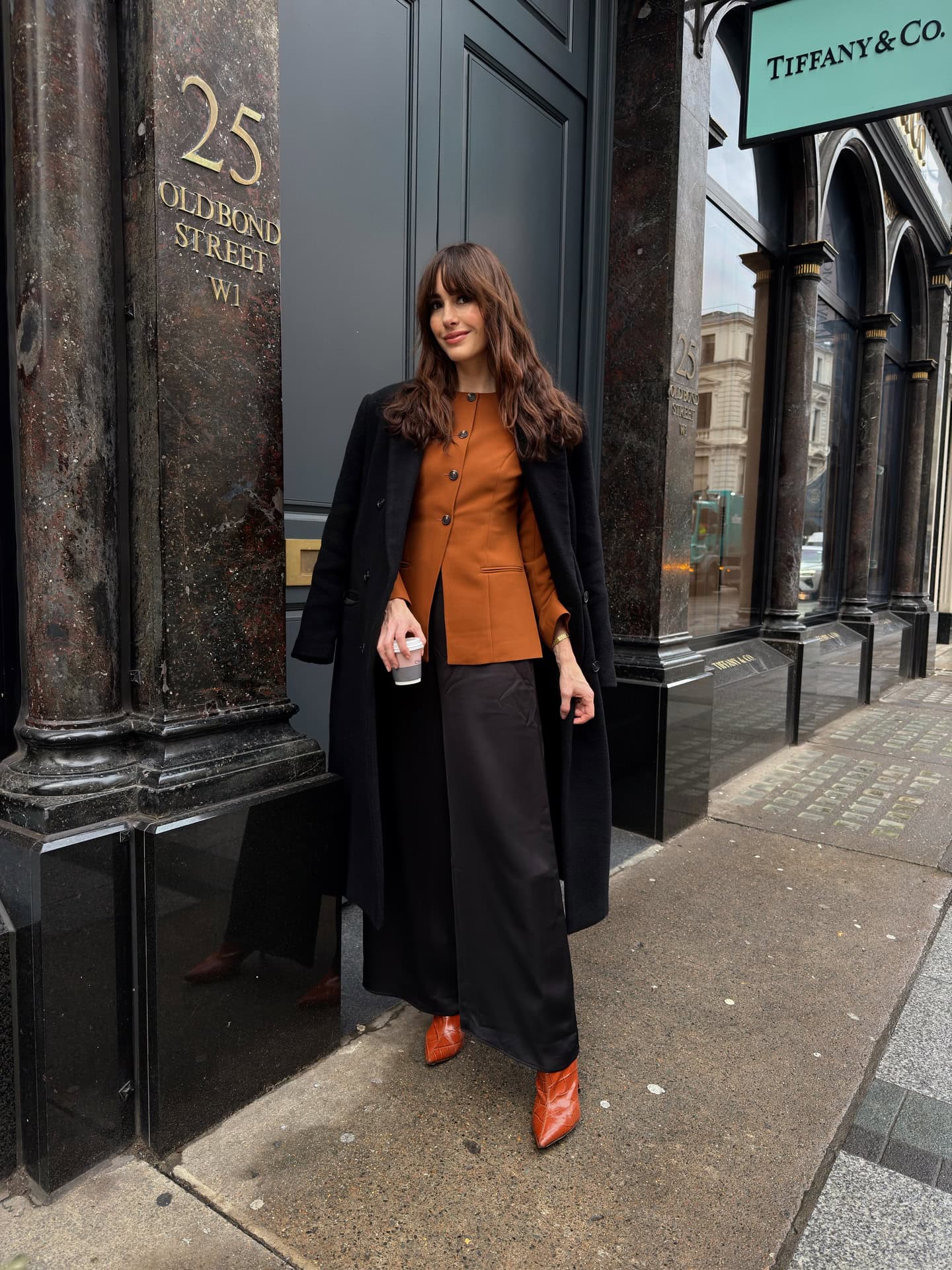 Black Long Coat and Orange Button-Front Blouse