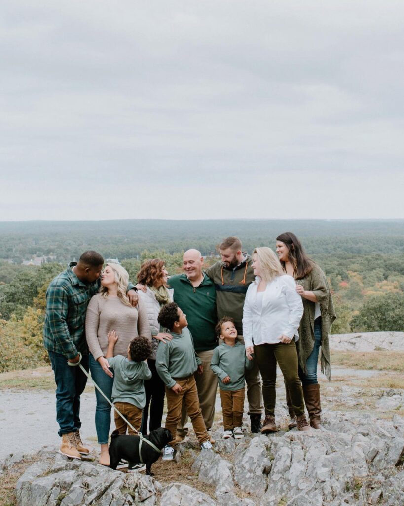 Large family on a rocky overlook in greens