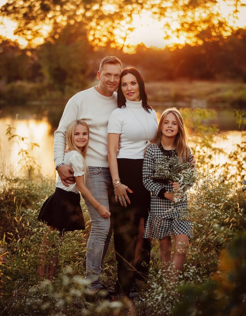 Family of four at golden hour in white and black