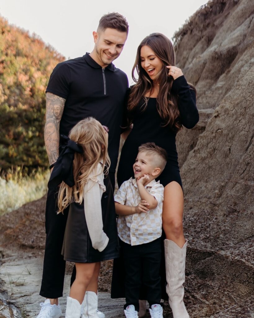Family of four in a canyon, edgy all-black and cream