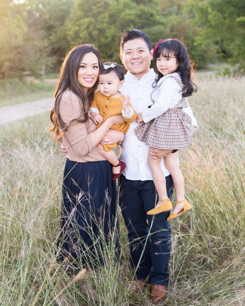 Family of four in tall grass, light and airy with mustard